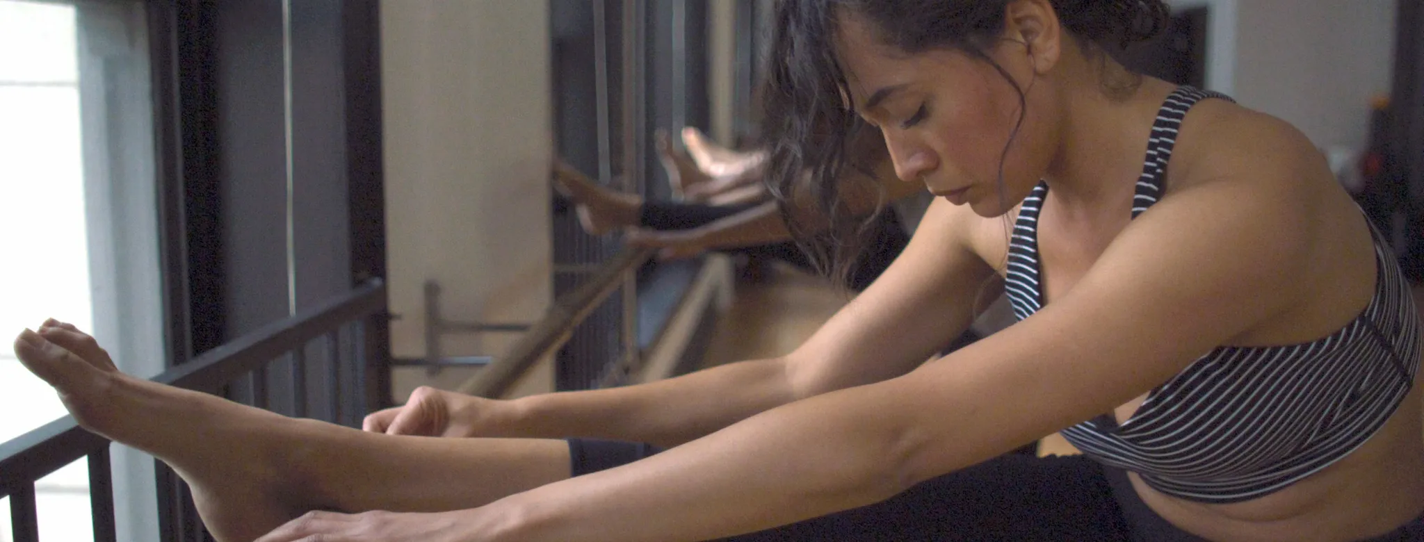 woman stretching in barre class